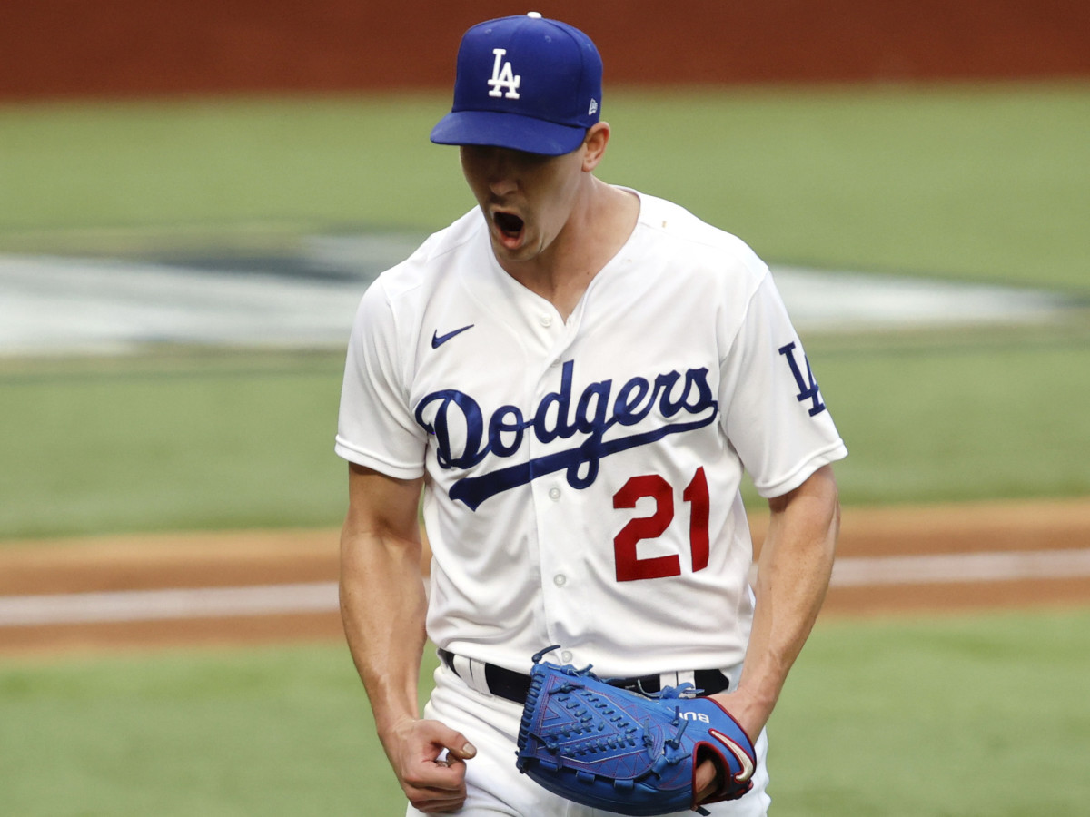 Los Angeles Dodgers starting pitcher Walker Buehler (21) reacts after a strike out in the sixth inning against the Atlanta Braves during game six of the 2020 NLCS at Globe Life Field.